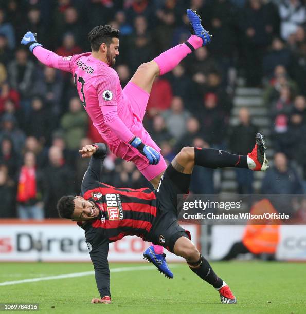 Liverpool goalkeeper Alisson Becker collides with Joshua King of Bournemouth during the Premier League match between AFC Bournemouth and Liverpool FC...