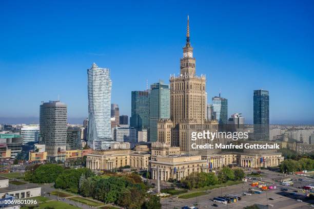 warsaw centrum, the very heart of the polish capital, with rondo dmowskiego roundabout, the zota 44 skyscraper and the soc-realist palace of culture and science, august 11, 2016 - warsaw photos et images de collection