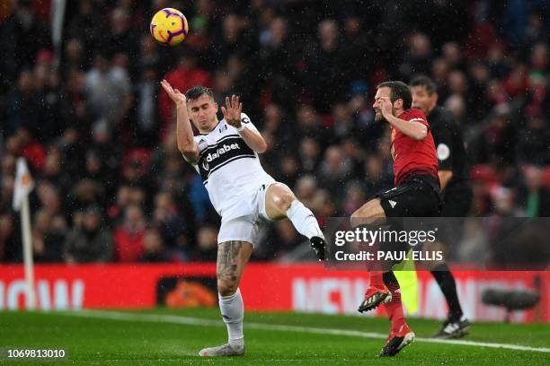 Manchester United's Spanish midfielder Juan Mata vies with Fulham's English defender Joe Bryan during the English Premier League football match...