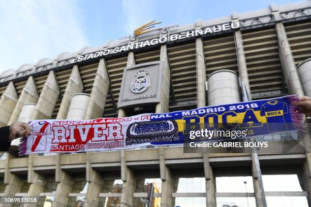 Scarf of River Plate and Boca Juniors football teams is displayed in front of the Santiago Bernabeu stadium in Madrid on December 8 on the eve of the...