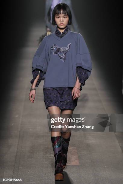 Model walks the runway during COACH 2019 early autumn collection fashion show on December 8, 2018 in Shanghai, China.