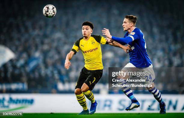 Jadon Sancho of Dortmund in action against Bastian Oczipka of Schalke during the Bundesliga match between FC Schalke 04 and Borussia Dortmund at...