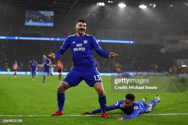 Callum Paterson of Cardiff City celebrates after scoring his team's first goal Josh Murphy of Cardiff City with during the Premier League match...
