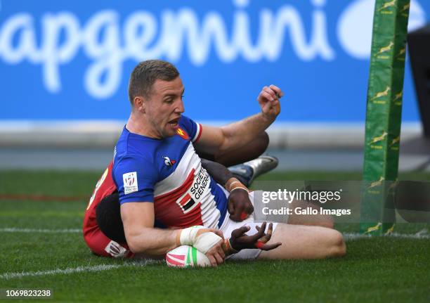 Thibauld Mazzoleni of France scores a try while tackled by Erick Ombasa of Kenya during day 1 of the HSBC Cape Town Sevens Pool C, match 19 between...