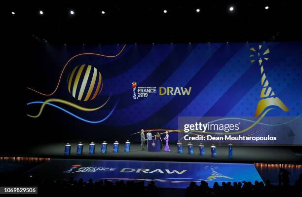 General view of the stage as Louis Saha and Alex Scott talk to draw hosts Denis Brogniart and Amanda Davies during the FIFA Women's World Cup France...