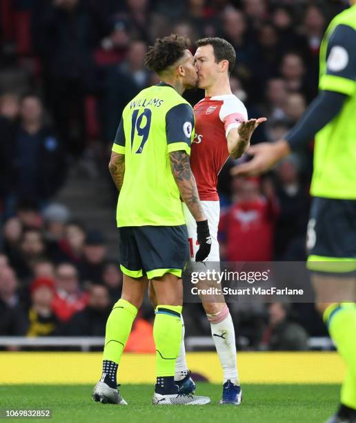 Arsenal defender Stephan Lichtsteiner clashes with Danny Williams of Huddersfield during the Premier League match between Arsenal FC and Huddersfield...