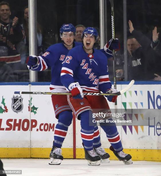 Filip Chytil of the New York Rangers celebrates his game winning goal at 4:32 of the third period against the Dallas Stars as he is joined by Jimmy...