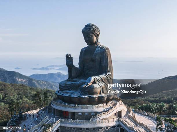 aerial view of hong kong tian tan buddha at dusk - lantau stock pictures, royalty-free photos & images