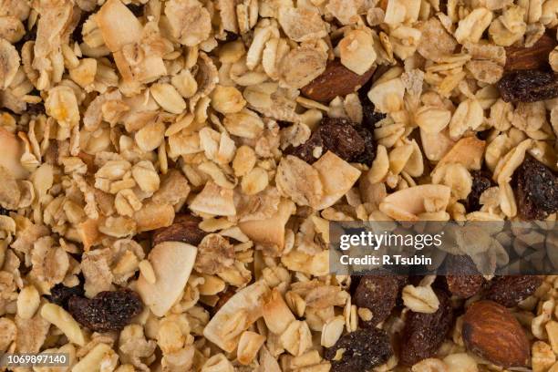 closeup of a pile of muesli cereal breakfast oatmeal - raisin bran stock pictures, royalty-free photos & images