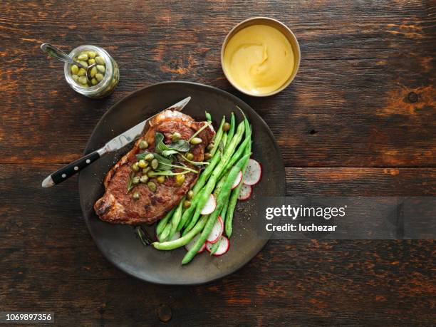 steak with mustard sauce, vegetables, herbs and capers - mustard stock pictures, royalty-free photos & images