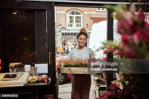 i just got stock of these beauties - flower shop worker stock pictures, royalty-free photos & images