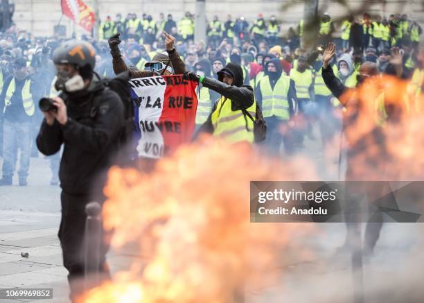 Yellow vests stage a protest against rising oil prices and deteriorating economic conditions in Paris, France on December 08, 2018.