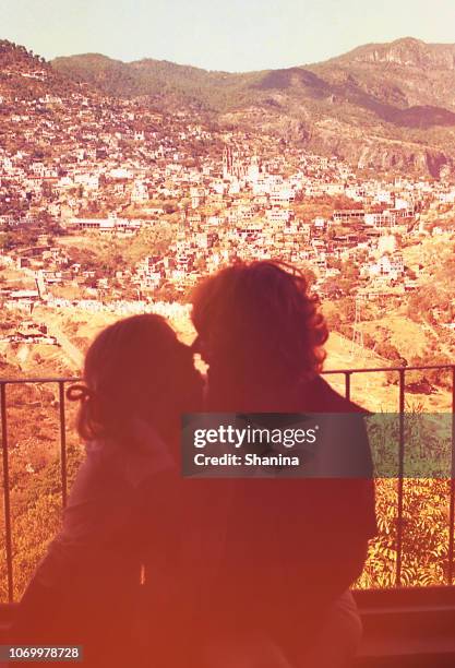 sillohuette of mother and daughter against a view. - family photograph stock pictures, royalty-free photos & images