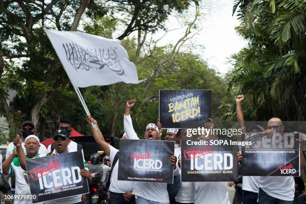 Protesters seen holding placards and shouting slogans during the Anti-ICERD 812 Rally. Thousands of supporters of the United Malay National...