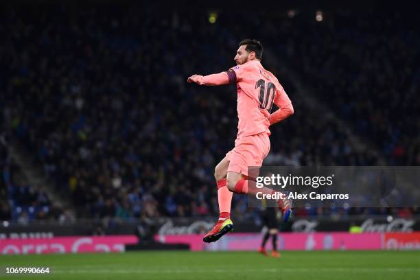 Lionel Messi of Barcelona celebrates after scoring his team's first goal during the La Liga match between RCD Espanyol and FC Barcelona at RCDE...