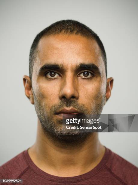 real pakistani man with blank expression - mug shot stock pictures, royalty-free photos & images