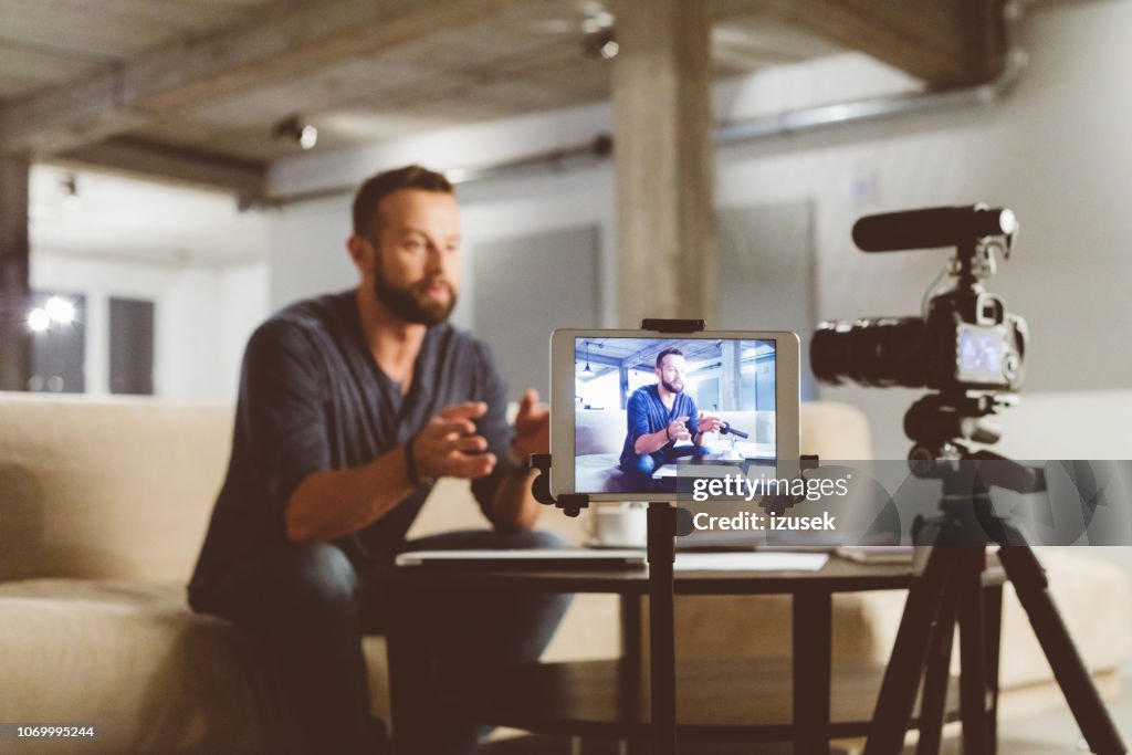 Young man making a video blog