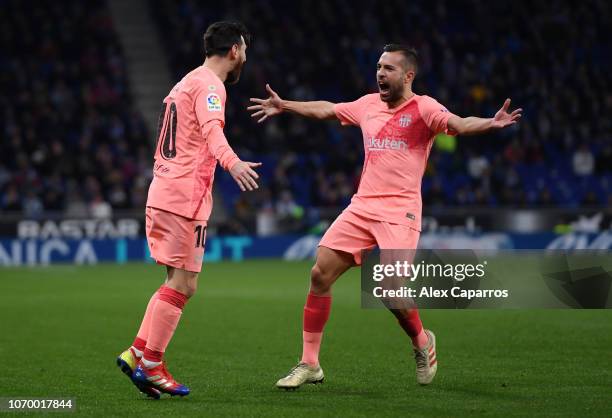 Lionel Messi of Barcelona celebrates after scoring his team's first goal with Jordi Alba of Barcelona during the La Liga match between RCD Espanyol...