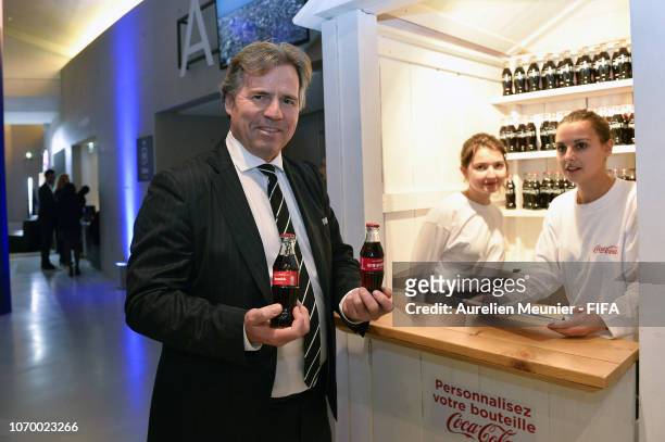 Chief commercial officer Philippe Le Floc'h visits the Coca Cola stand before the final draw for the FIFA Women's World Cup 2019 at "La Seine...