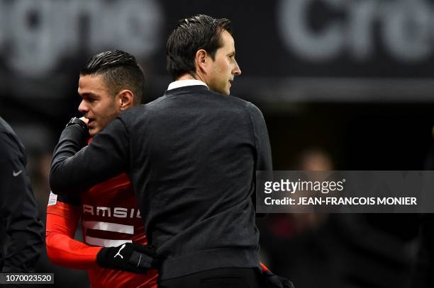 Rennes' French coach Julien Stephan congatulates Rennes' French forward Hatem Ben Arfa after scoring during the French L1 football match between...