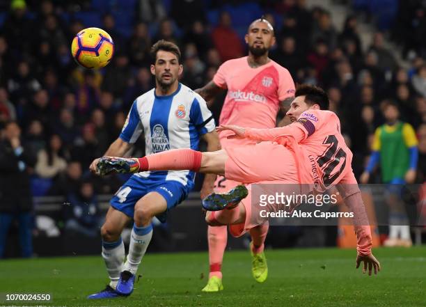 Lionel Messi of Barcelona shoots during the La Liga match between RCD Espanyol and FC Barcelona at RCDE Stadium on December 8, 2018 in Barcelona,...