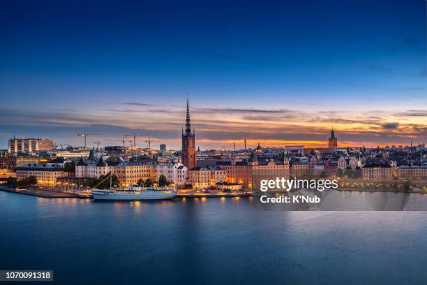 sunset over riddarholmen chruch in old town stockholm city, sweden - stockholm ストックフォトと画像