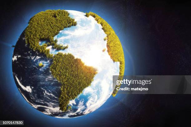 earth globe in space with cartoony grass continents & glowing atmosphere - artificial grass stock pictures, royalty-free photos & images