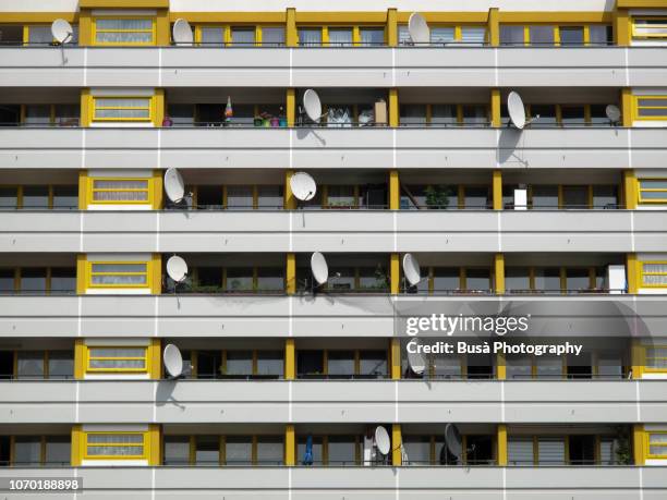 satellite dishes on balconies of residential building in the district of kreuzberg, berlin - berlin modernism housing estates stock pictures, royalty-free photos & images