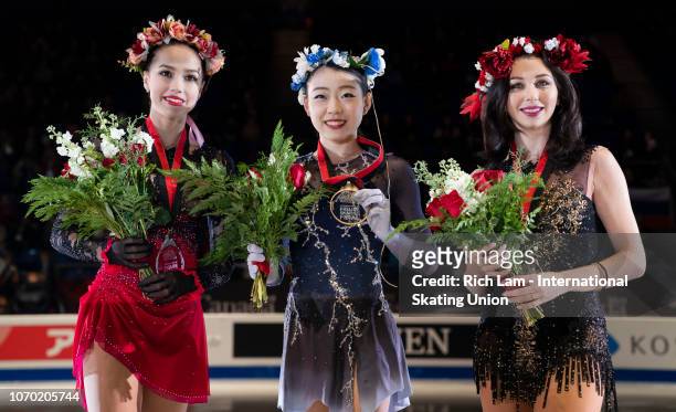 First place Rika Kihira of Japan , second place Alina Zagitova of Russia and third place Elizaveta Tuktamysheva of Russia pose for photos after the...