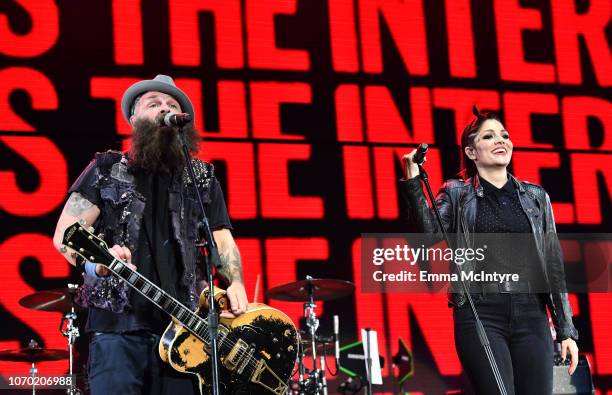 Tim Armstrong of the band Rancid and Aimee Allen of the band The Interrupters perform on stage during the KROQ Absolut Almost Acoustic Christmas at...