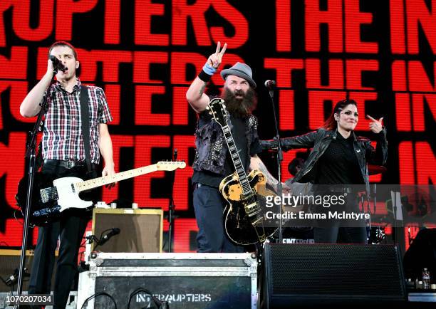Kevin Bivona of the band The Interrupters, Tim Armstrong of the band Rancid and Aimee Allen of the band The Interrupters perform on stage during the...