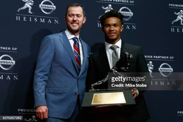 Kyler Murray and head coach Lincoln Riley of the Oklahoma Sooners poses for a photo after winning the 2018 Heisman Trophy on December 8, 2018 in New...