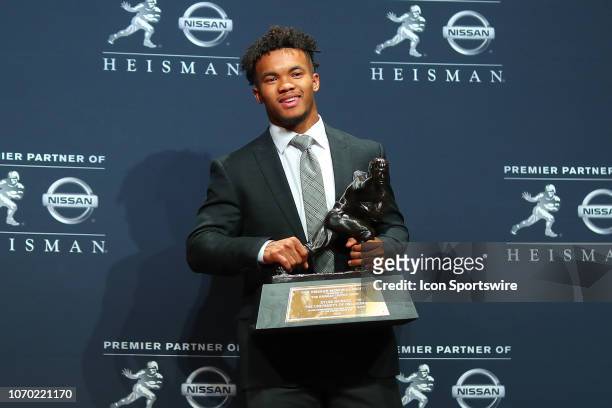 Oklahoma quarterback Kyler Murray poses for photos after winning the 84th Heisman Trophy on December 8, 2018 at the New York Marriott Marquis in New...