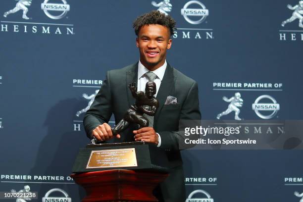 Oklahoma quarterback Kyler Murray poses for photos after winning the 84th Heisman Trophy on December 8, 2018 at the New York Marriott Marquis in New...