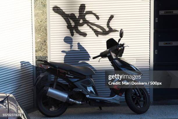 motorscooter and graffiti - mari donkers stock pictures, royalty-free photos & images