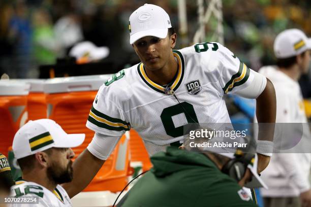 Aaron Rodgers and DeShone Kizer of the Green Bay Packers react from the sidelines against the Seattle Seahawks in the fourth quarter during their...