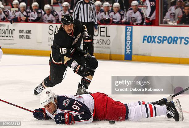 Rostislav Klesla of the Columbus Blue Jackets hits the ice defending the puck against George Parros of the Anaheim Ducks during the game on November...