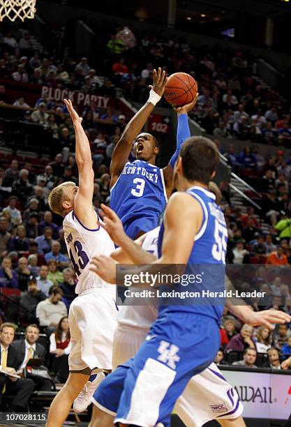 Kentucky's Terrence Jones puts up a shot over Portland defender Luke Sikma, left, during the first half at Rose Garden Arena in Portland, Oregon,...