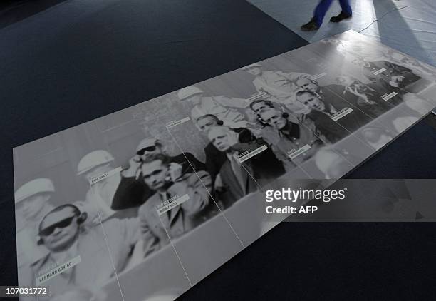 By SIMON STURDEE - Picture taken on November 16, 2010 shows a large historical picture which shows the defendants of the Nuremberg Trials at the new...