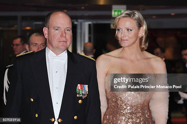 Albert II of Monaco and Charlene Wittstock arrive to attend the Monaco National day Gala concert at Grimaldi forum on November 19, 2010 in Monaco,...