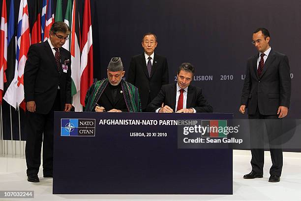 Afghanistan President Hamid Karzai and NATO Secretary General Anders Fogh Rasmussen sign a declaration for the Afghanistan-NATO partnership as United...