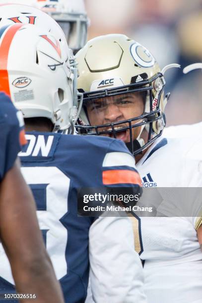 Quarterback Tobias Oliver of the Georgia Tech Yellow Jackets reacts to safety Brenton Nelson of the Virginia Cavaliers at Bobby Dodd Stadium on...