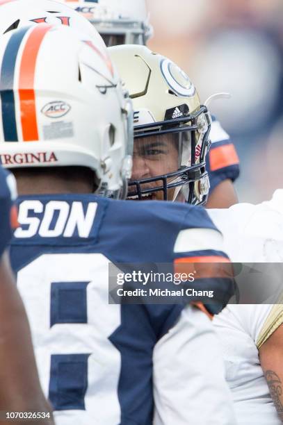 Quarterback Tobias Oliver of the Georgia Tech Yellow Jackets reacts to safety Brenton Nelson of the Virginia Cavaliers at Bobby Dodd Stadium on...