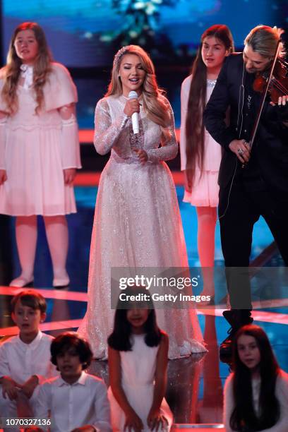 Shirin David and David Garrett perform at the Ein Herz Fuer Kinder Gala show at Studio Berlin Adlershof on December 8, 2018 in Berlin, Germany.