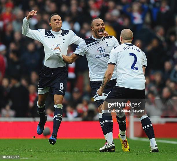 Younes Kaboul of Tottenham celebrates with team mates Jermaine Jenas and Alan Hutton after scoring the winner during the Barclays Premier League...