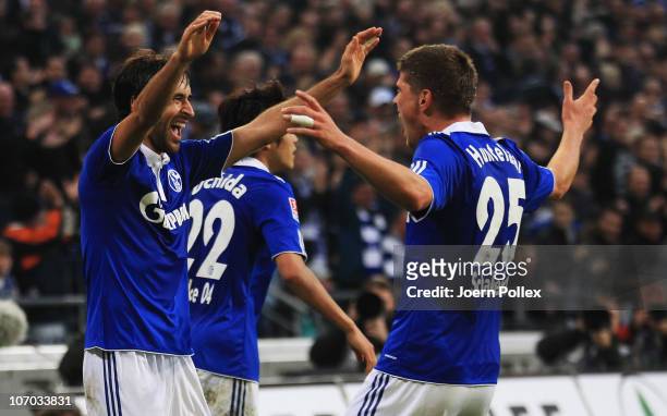 Raul of Schalke celebrates with his team mate Klaas-Jan Huntelaar after scoring his team's second goal during the Bundesliga match between FC Schalke...