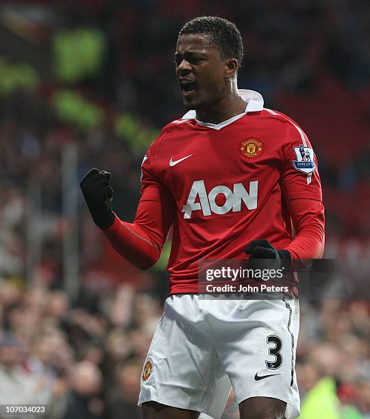 Patrice Evra of Manchester United celebrates scoring their first goal during the Barclays Premier League match between Manchester United and Wigan...