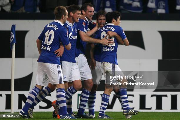 Raúl Gonzalez of Schalke celebrates his third goal with Atsuto Uchida of Schalke , Ivan Rakitic , Klaas-Jan Huntelaar of Schalke and Christoph...