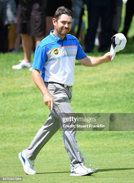 Louis Oosthuizen of South Africa waves his cap to the fans on the 18th hole during the final round of the South African Open at Randpark Golf Club on...