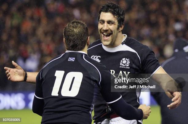Kelly Brown and Dan Parks of Scotland celebrate after beating South Africa in the international match between South Africa and Scotland at...